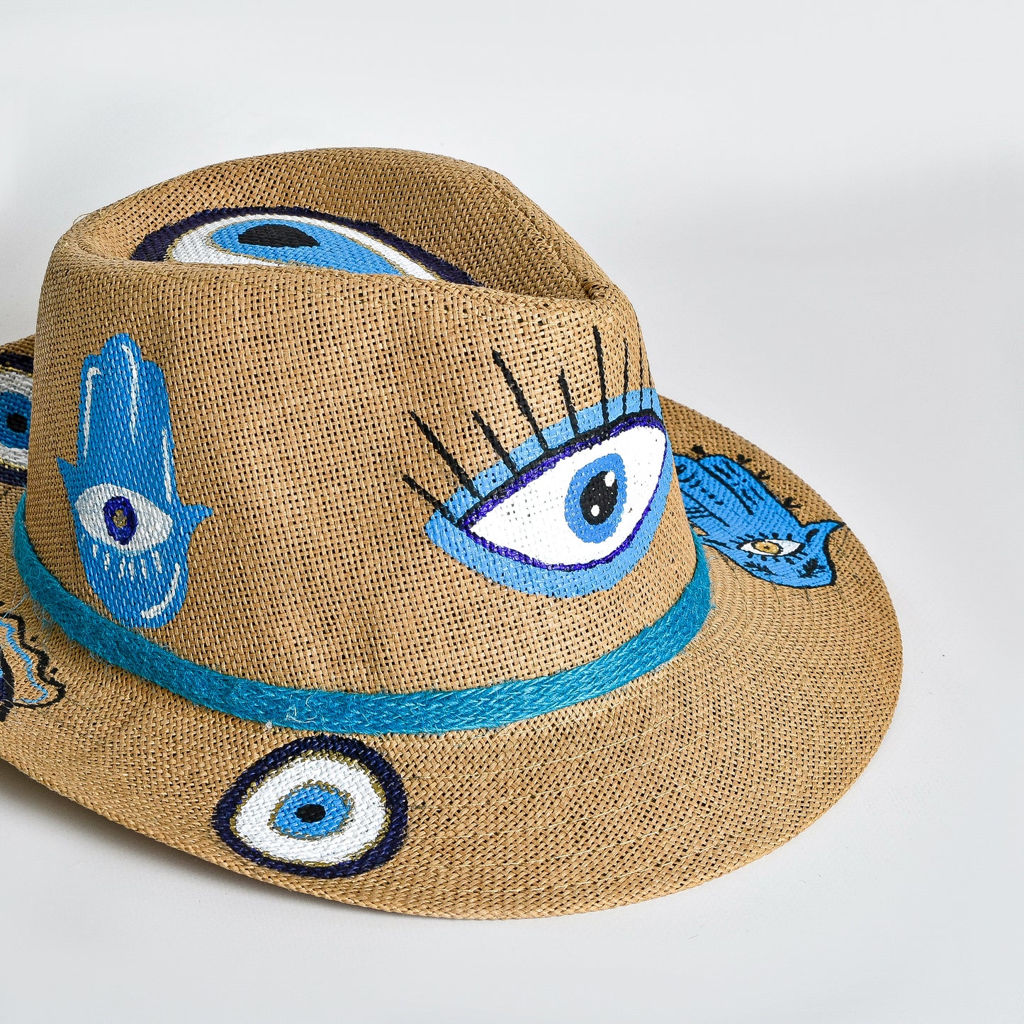 Beige with Blue Eyes and hands Hat